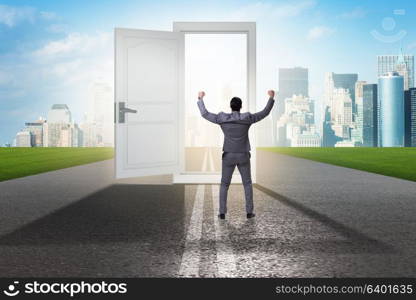 Businessman in front of door in business opportunities concept