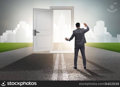 Businessman in front of door in business opportunities concept