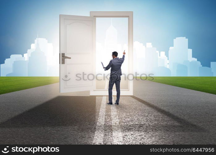 Businessman in front of door in business opportunities concept