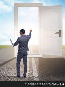 Businessman in front of door in business opportunities concept. The businessman in front of door in business opportunities conce