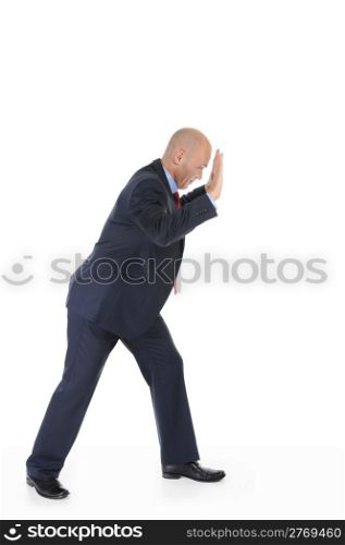 Businessman in full growth rests on the invisible wall. Isolated on white background