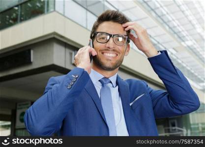 businessman in glasses looking at the camera