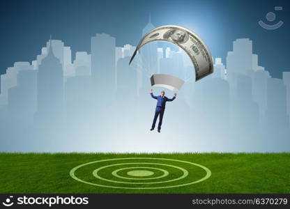 Businessman in golden parachute concept