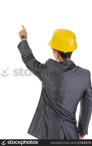 Businessman in helmet points finger up. Isolated on white background