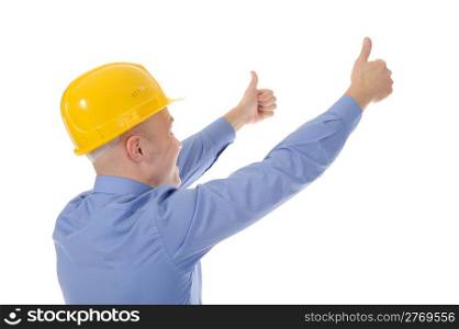Businessman in helmet points hand up. Isolated on white background