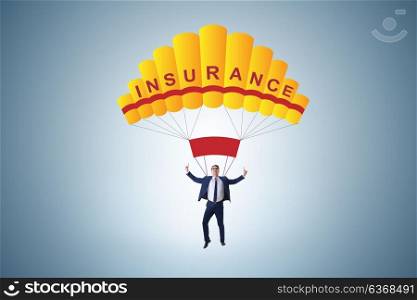 Businessman in insurance concept on parachute