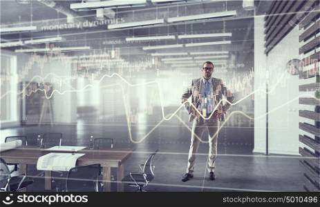 Businessman in modern office mixed media. Young elegant businessman in office thinking over business