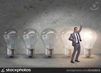 Businessman in new idea concept with light bulb