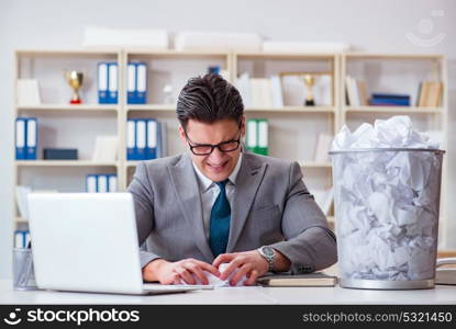 Businessman in paper recycling concept in office