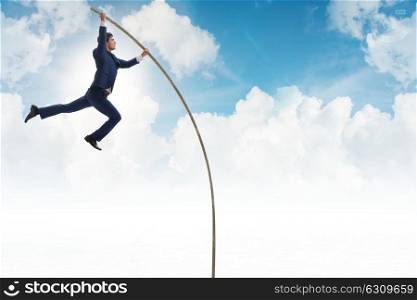 Businessman in pole vaulting concept
