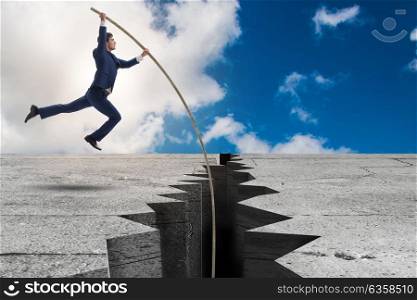 Businessman in pole vaulting concept. The businessman in pole vaulting concept