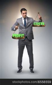 Businessman in profit benefit balance concept