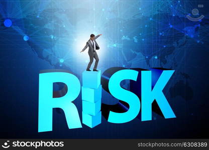 Businessman in risk and reward business concept