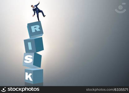 Businessman in risk and reward business concept