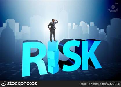 Businessman in risk and reward business concept