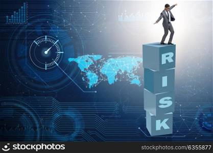 Businessman in risk and reward business concept. The businessman in risk and reward business concept