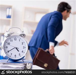 Businessman in rush trying to meet deadline. The businessman in rush trying to meet deadline