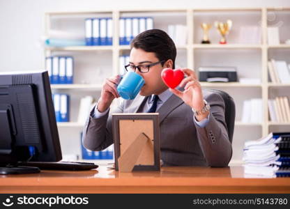 Businessman in saint valentine concept in office