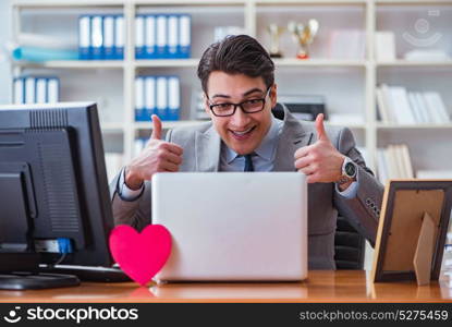 Businessman in saint valentine concept in office