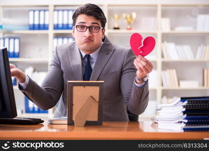 Businessman in saint valentine concept in office