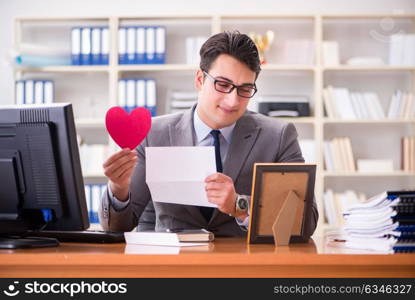 Businessman in saint valentine concept in office