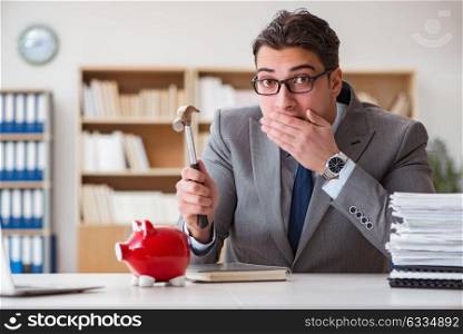 Businessman in search of his savings with piggy bank