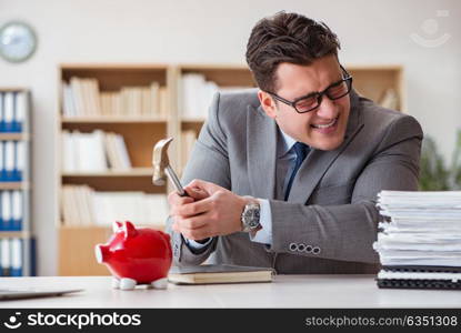 Businessman in search of his savings with piggy bank