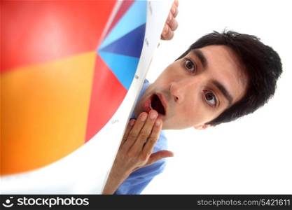 Businessman in shock at a pie chart