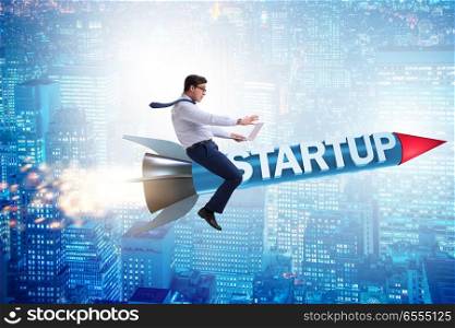 Businessman in start-up concept flying on rocket