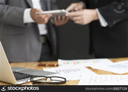businessman in suit analyze with market analysis business chart document
