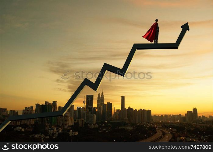 Businessman in suit and cape hero and charts with sunrise city skyline background . Financial economic growth concept