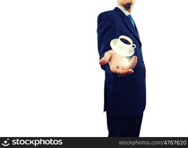 Businessman in suit. Close up of businessman holding coffee in palm