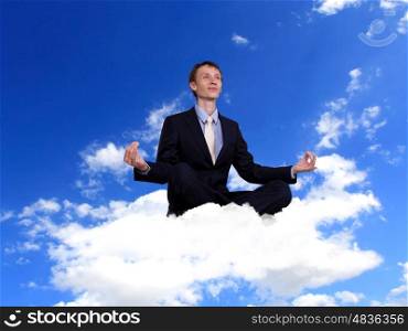 Businessman in suit praying for success in business