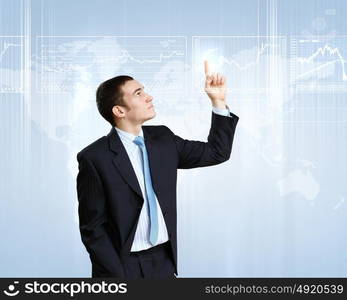 Businessman in suit working with touch screen technology