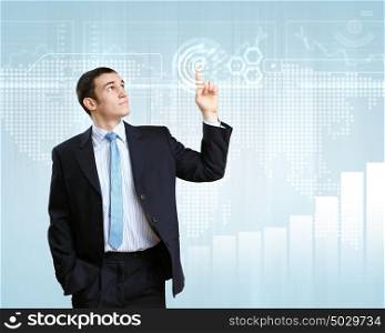 Businessman in suit working with touch screen technology