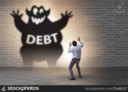 Businessman in the debt and loan concept. Businessman in debt and loan concept