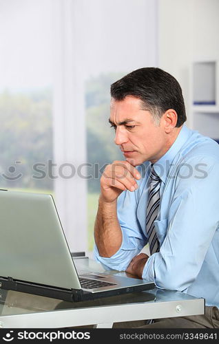 Businessman in the office working on laptop computer