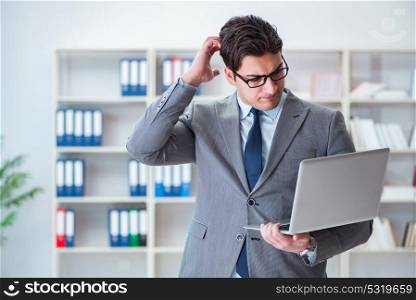 Businessman in the office working with laptop