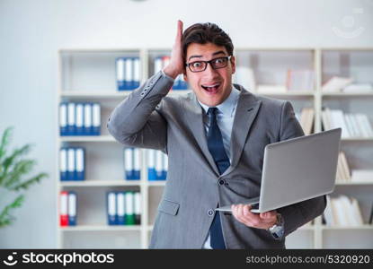 Businessman in the office working with laptop