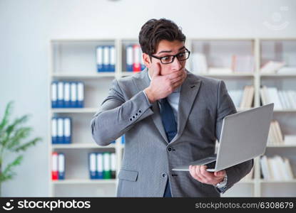 Businessman in the office working with laptop