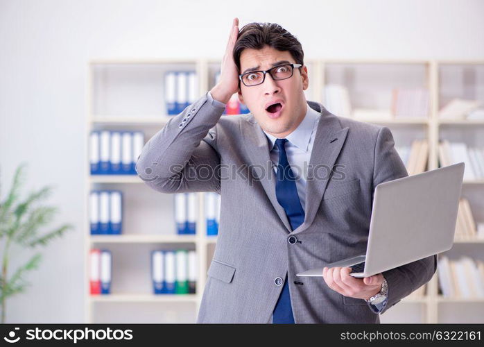 Businessman in the office working with laptop