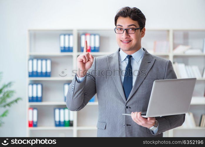 Businessman in the office working with laptop