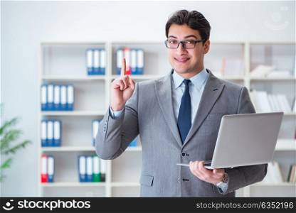 Businessman in the office working with laptop