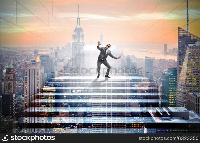 Businessman in uncertainty concept on career ladder