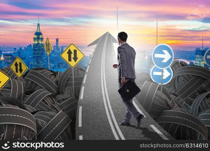 Businessman in uncertainty concept on road intersection crossroads. Businessman in uncertainty concept on road intersection crossroa