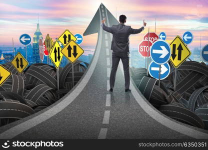 Businessman in uncertainty concept on road intersection crossroads. Businessman in uncertainty concept on road intersection crossroa