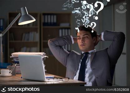 Businessman in uncertainty concept with many unanswered questions. Businessman in uncertainty concept with many unanswered question