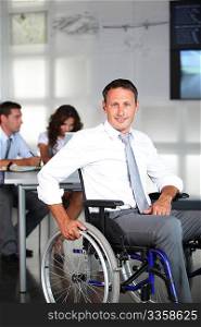 Businessman in wheelchair in the office