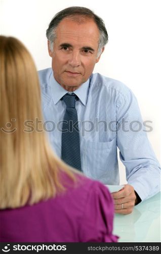 Businessman interviewing a young woman