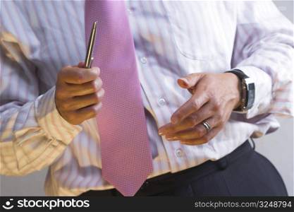 Businessman is counting on hands while he is explaning his calculations.